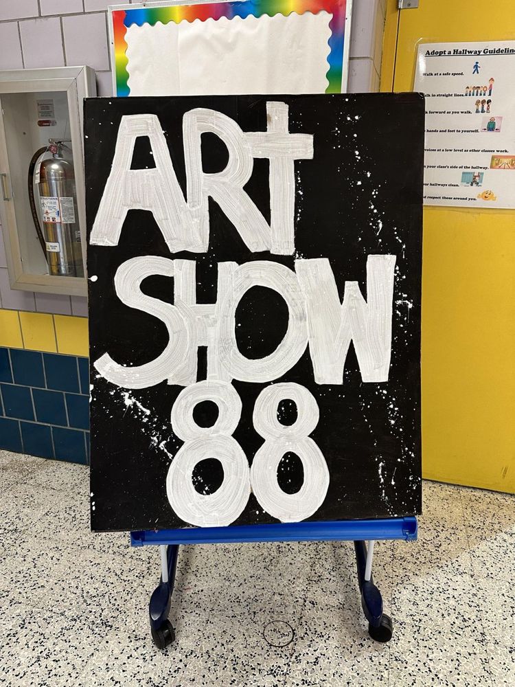Hand-lettered Art Show 88 sign on an easel