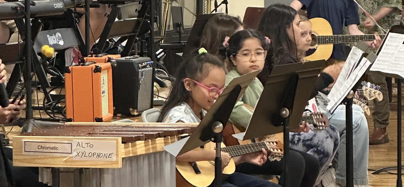 Students playing instruments in the PS 88Q concert band