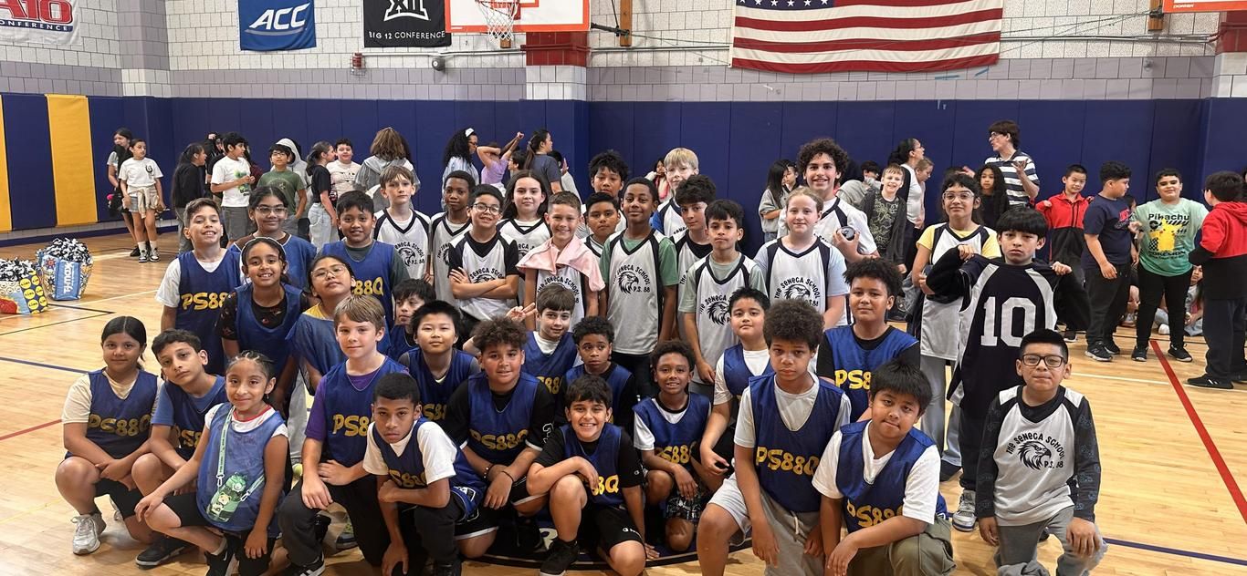 The grade 4 and 5 basketball team in the gym