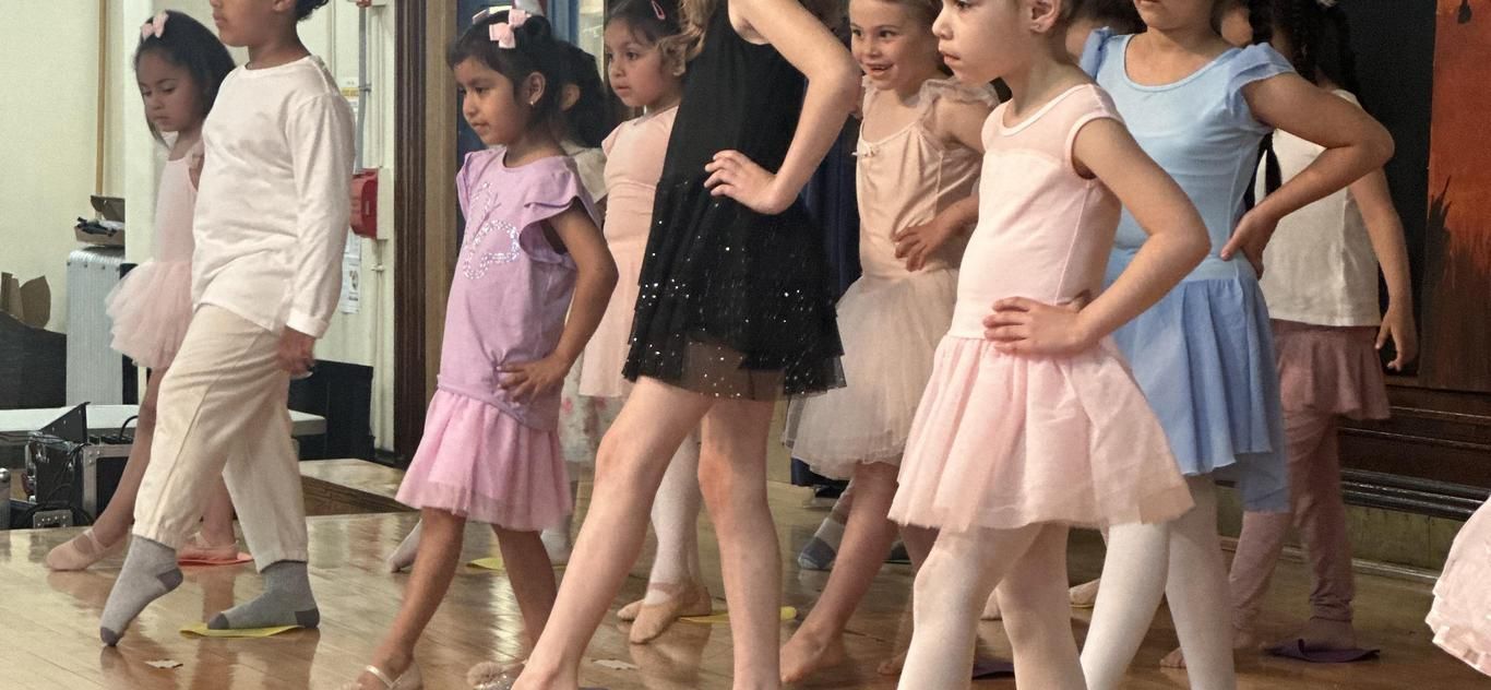 Students in ballet costumes during the Joffrey Ballet residency